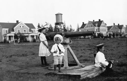 Children playing outside Fort Lawton Officer's Row. Circa 1900. UW Special Collections #UW 4792.