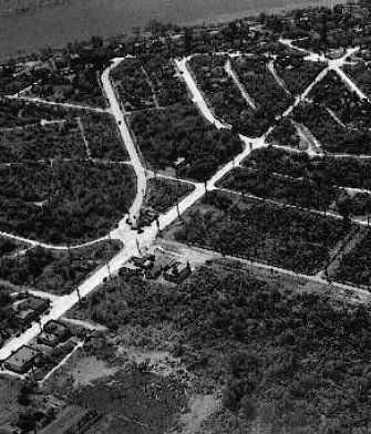 An early aerial view of the village--looking southwest across W. McGraw at 34th Ave W.
